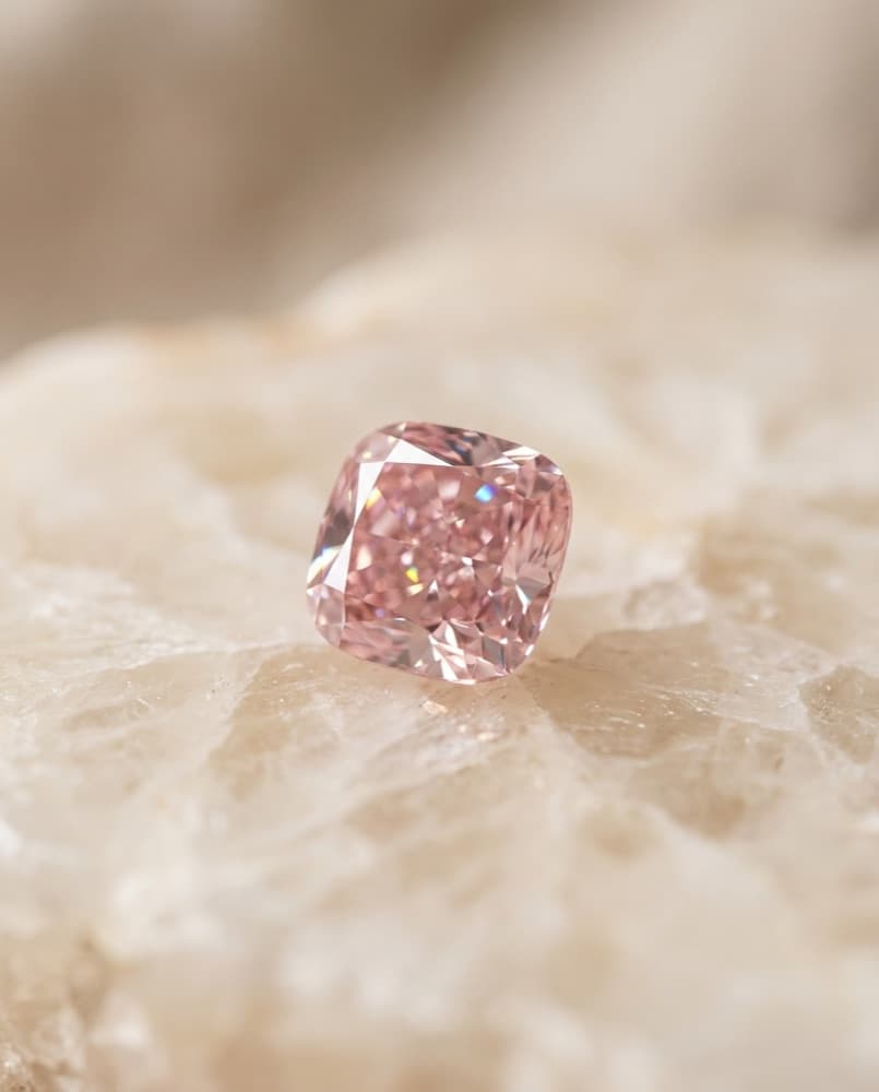 Macro study of a natural fancy-pink diamond — editorial imagery of the colour family we source